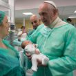 Pope Francis holds a baby as he visits the neonatal unit at San Giovanni Hospital in Rome Sept. 16. The visit was part of the pope’s series of Friday works of mercy during the Holy Year. (CNS photo/L’Osservatore Romano, handout)