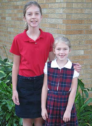 Noel, 12, and Jenna Barwick, 8, pose in their St. Matthias School uniforms earlier this school year. The girls' mother, Jane Barwick, is a 1980 graduate of St. Matthias School, Milwaukee. (Submitted photo courtesy the Barwick family)