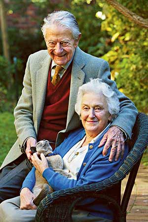 Drs. John and Evelyn Billings are pictured with their cat in the garden of their home in Melbourne, Australia, in this 2004 file photo. John Billings, who with his wife pioneered a revolutionary church-backed method for couples to avoid or achieve conception, died April 1 in Richmond, Australia. By the time of his death, teaching centers on the Billings Ovulation Method of natural family planning had been established in more than 100 countries. (CNS photo/Peter Casamento)