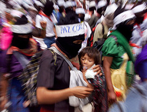 Masked Zapatista women march out of the highland town of Altamirano in the southern Mexico state of Chiapas in during a 1999 protest demanding that Mexican soldiers leave the state. The Zapatista National Liberation Army has reappeared in Chiapas. (CNS p hoto/Daniel Aguilar, Reuters)