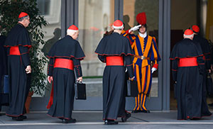 Cardinals Roger M. Mahony, retired archbishop of Los Angeles, Francis E. George of Chicago, Donald W. Wuerl of Washington and Theodore E. McCarrick, retired archbishop of Washington, arrive for a general congregation meeting in the synod hall at the Vatican March 5. The world's cardinals are meeting for several days in advance of the conclave to elect the new pope. (CNS photo/Stefano Rellandini, Reuters)