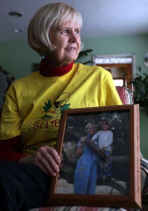 Jean Davidson, 75, granddaughter of the founder of Harley-Davidson, holds a photo of her and her 4-year-old grandson, Ryder, whose drowning death in 2006 led to the creation of the Yell and Tell Program, a curriculum to teach children to take action and warn someone when they see a dangerous situation. (Catholic Herald photo by Allen Fredrickson)