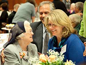 Sr. Camille Kliebhan, a Sister of St. Francis of Assisi, chats with her niece Mary Beth and Scott Moore, during her April 7, 90th birthday celebration. (Submitted photo by Kou Vang, courtesy Cardinal Stritch University)