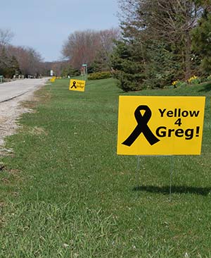 "Yellow 4 Greg" yard signs dot the landscape in several New Berlin neighborhoods. (Catholic Herald photo by Ricardo Torres)