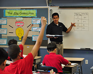 Irving Ibarra, a Nativity Jesuit graduate teaches a math class at the school on Monday, May 6. Ibarra, a graduate of Marquette University High School and Marquette University, also serves as assistant to the director of graduate support at Nativity Jesuit.