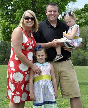 Pictured above is the Halbesma family: Sarah her husband, Drew, and daughters Isabel, 6, and Addison, 2. (Catholic Herald photo by John Kimpel)