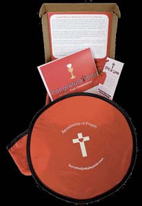 A gift box is one of the items available through the Apostleship of Prayer website. Packaged as a first Communion gift set, it includes a card of congratulation, Sacred Heart key chain and card, cloth Frisbee, and message to parents about the Apostleship of Prayer. (Submitted photo courtesy the Apostleship of Prayer)