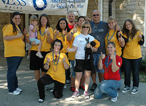 Jessica Borkoswki, front row, far right, serves as walk coordinator for the Milwaukee Out of the Darkness Community Walk, an event designed to raise money and awareness for suicide prevention. (Submitted photo courtesy Jessica Borkowski)