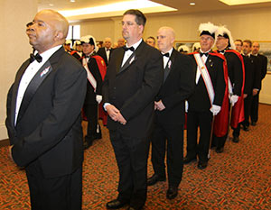 Candidates for the Knights of Columbus patriotic 4th Degree line up outside the ballroom of the Paper Valley Hotel in Appleton on Saturday, April 13, in preparation for ceremonies in which the group became “Sir” Knights. (Catholic Herald photo by Steve Wideman)