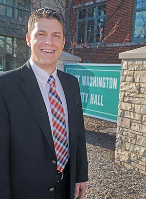 Tom Mlada, pictured outside Port Washington City Hall in late March, was elected mayor last spring. (Catholic Herald photo by Sam Arendt)