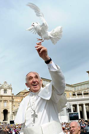 Pope  Francis holds a dove before his weekly audience in St. Peter’s Square at the Vatican May 15. (CNS photo/L’Osservatore Romano via Reuters)
