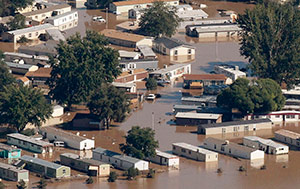 Mobile homes lie flooded in a town in Weld County, Colo., Sept. 17. Search-and-rescue teams bolstered by National Guard troops fanned out across Colorado's flood-stricken landscape, as a week of torrential rains blamed for at least eight deaths and the destruction of at least 1,600 homes. (CNS photo/Rick Wilking, Reuters)