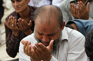 Pakistani Muslims pray during Ramadan in Karachi. Church officials in Pakistan have backed a government plea to the international community not to demonize all Muslims because of acts of terrorism committed by a few extremists, reported ucanews.com. (CNS photo/Rehan Khan, EPA)