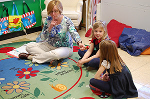 Heidi Spellman, K5 and grade 1 teacher at Queen of Apostles School, Pewaukee, teaches students in her classroom in February. (Catholic Herald photo by Ricardo Torres)