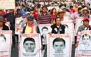 Parents of 43 missing Mexican students of the Ayotzinapa teachers' college near Chilpancingo, Mexico, participate in a 2015 protest in Mexico City. (CNS photo/Mario Guzman, EPA)