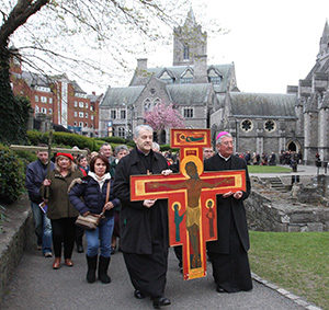 Anglican Archbishop Michael Jackson and Archbishop Diarmuid Martin of Dublin lead an ecumenical Good Friday procession in 2012 in Dublin. Archbishop Martin confirmed that Pope Francis, or his successor, will visit Ireland in 2018 for the World Meeting of Families. (CNS photo/John Mc Elroy)