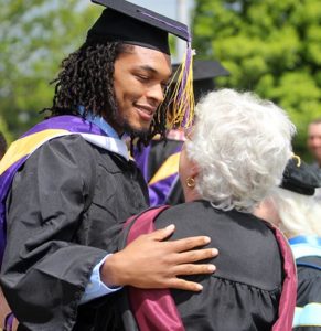 Christian Johnson embraces professor Peggy Tillman after St. Catharine College's graduation ceremony May 14 in Springfield, Ky. Citing insurmountable challenges, including a decline in enrollment and high debt, St. Catharine College trustee John Turner announced June 1 that the school will close in late July. (CNS photo/courtesy St. Catharine College)