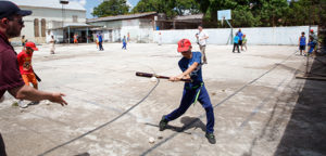     A boy hits a ball during the Holy Childhood Association baseball encounter in Cuba in late May. The camp was hosted by a team of professional baseball coaches and Catholic leaders from the Pontifical Mission Societies in the United States, which oversees the association. (CNS photo/Gregory L. Tracy, the Pilot)