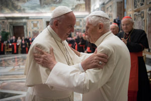 Pope Francis greets retired Pope Benedict XVI during a June 28 ceremony at the Vatican marking the 65th anniversary of the retired pope's priestly ordination. (CNS photo/L'Osservatore Romano, handout)