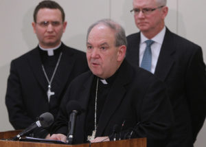 Archbishop Bernard A. Hebda speaks at a news conference following the Dec. 18 filing of a settlement agreement between the Archdiocese of St. Paul and Minneapolis and the Ramsey County Attorney's Office. (CNS photo/Dave Hrbacek, The Catholic Spirit)