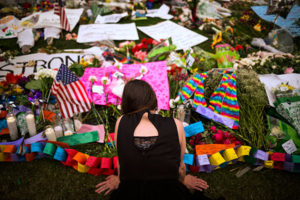 A woman visits a memorial in downtown Orlando, Fla., June 14, that honors the victims of the mass shooting at a gay nightclub. (CNS photo/John Taggart, EPA)
