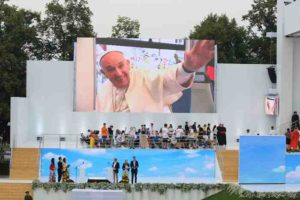 Pope Francis is pictured on a screen en route to a welcoming ceremony with World Youth Day pilgrims July 28 at Blonia Park in Krakow, Poland. (CNS photo/Bob Roller) See POPE-POLAND-WYD-WELCOME July 28, 2016.