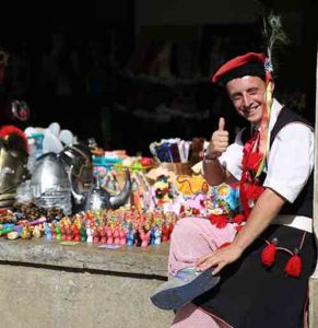 A vendor dressed in traditional Polish attire is seen July 24 along a street in in Krakow ahead of World Youth Day. (CNS photo/Bob Roller)