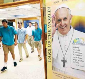 A banner featuring an image of Pope Francis is seen in a hallway following a commissioning Mass July 17 for World Youth Day pilgrims at Kellenberg Memorial High School in Uniondale, N.Y. The Marianists of the Province of Meribah are taking 121 seniors and 14 moderators from their community’s high schools, Kellenberg Memorial and Chaminade in Mineola, N.Y., on pilgrimage to Krakow, Poland, for World Youth Day, July 25-31. (CNS photo/Gregory A. Shemitz)