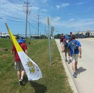 Walkers participating in the 2013 50-mile pilgrimage head toward their final destination of Holy Hill. This year’s pilgrimage, led by Fr. Luke Strand, vocation director, is being called the “Pilgrimage of Mercy” and coincides with World Youth Day in Poland. (Submitted photo courtesy Michael Malucha)