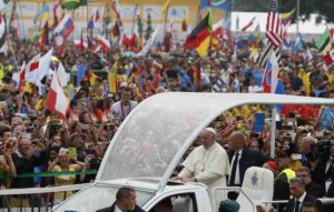 Pope Francis greets the crowd as he arrives to attend the World Youth Day welcoming ceremony in Blonia Park in Krakow, Poland, July 28. (CNS photo/Paul Haring) See POPE-POLAND-WYD-WELCOME July 28, 2016.