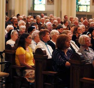 Mourners listen as Archbishop Jerome E. Listecki delivers the homily at the funeral Mass for Sr. Margaret in the chapel at the St. Joseph Center in Milwaukee, Sept. 2. (Catholic Herald photos by Allen Fredrickson) 