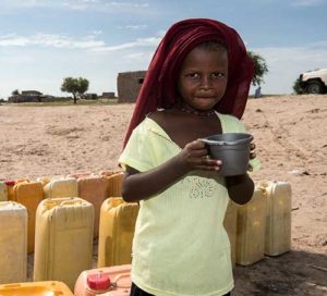 In Kindjani, Niger, a young girl drinks water delivered to the community by Catholic Relief Services. (CNS photo/Michael Stulman, CRS) 