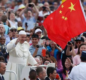 China’s flag is seen as Pope Francis greets the crowd during his general audience in St. Peter’s Square at the Vatican June 15. (CNS photo/Paul Haring)