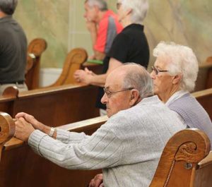 Leonard and Myra Diedrich, pictured during Sunday Mass, Aug. 28, are among the parishioners at Blessed Virgin Mary Parish, Marytown, who could make use of the newly installed Hearing Loop. (Catholic Herald photo by Tracy Rusch)