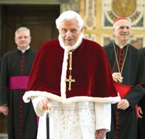 Pope Benedict XVI walks with his cane in 2013 at the Vatican following his final general audience. Retirement has given the 89-year-old Pope Benedict what he describes as the gift of silence to enter more deeply into prayer, especially with the Psalms and the writings of early church theologians. (CNS photo/L’Osservatore Romano)