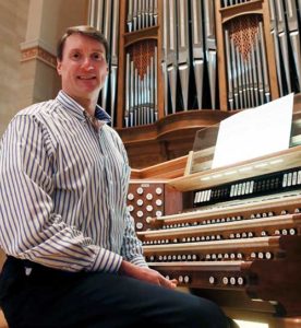 Michael Batcho, the director of music at the Cathedral of St. John the Evangelist, Milwaukee, plays the organ on Thursday, Oct. 13. The instrument, designed by famous recitalist Robert Noehren, is marking its 50th year in the cathedral. (Catholic Herald photo by Allen Fredrickson)