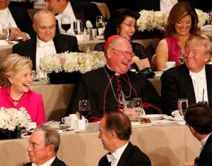 New York Cardinal Timothy M. Dolan shares a light moment with U.S. Democratic presidential nominee Hillary Clinton and Republican presidential nominee Donald Trump during the 71st annual Alfred E. Smith Memorial Foundation Dinner at the Waldorf Astoria hotel in New York City Oct. 20. The charity gala, which honors the memory of the former New York Democratic governor who was the first Catholic nominated by a major political party for the U.S. presidency, raises money to support not-for-profit organizations that serve children in need. (CNS photo/Gregory A. Shemitz)