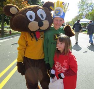 Adelaide and Archer Davis from St. Katharine Parish, Beaver Dam, pose with a character from the 2015 Soles walk. (Submitted photo courtesy Angela Davis)