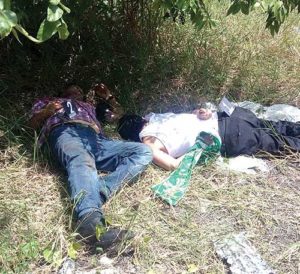 The bodies of Frs. Alejo Nabor Jimenez Juarez and Jose Alfredo Juarez de la Cruz are seen along a roadside Sept. 19 in the Mexican state of Veracruz. The priests were found murdered that day, just hours after they were kidnapped from the low-income neighborhood where they served. (CNS photo/Diario Marcha, Handout via EPA)
