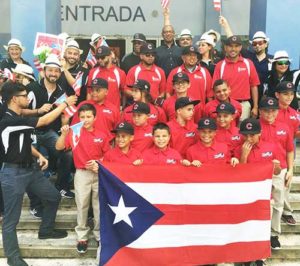 The Criollos team celebrates with well-wishers outside of The Sports Museum of Puerto Rico. As one of the first Latino players in the MLB, Felix Mantilla is recognized by the museum as one of Puerto Rico’s immortal athletes. The trip was made possible by fundraising by the North Star Providers. Next summer, little leaguers from Puerto Rico will visit Milwaukee as part of the cultural exchange. (Submitted photo courtesy Mali Bria) 