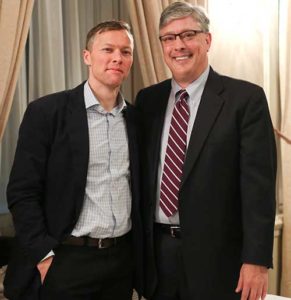 Matthew Desmond, professor at Harvard University and author of “Evicted: Poverty and Profit in the American City,” left, and Mark Angelini, senior vice president for Mercy Housing Lakefront, pose for a photo at the “Live in Hope” reception at the Milwaukee Athletic Club on Oct. 26. (Submitted photo courtesy Kelsey Jorissen)