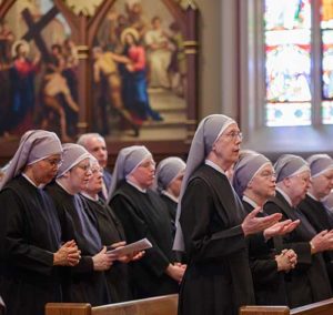 Members of the Little Sisters of the Poor pray during Mass at the Basilica of the Sacred Heart at the University of Notre Dame in Indiana April 9. (CNS photo/Peter Ringenberg, Notre Dame Center for Ethics and Culture)