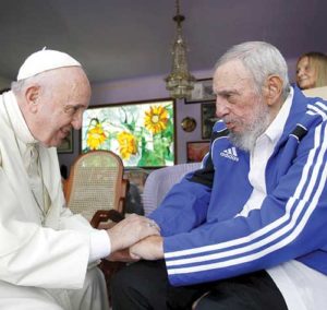 Pope Francis and former Cuban President Fidel Castro grasp each other’s hands at Castro’s residence in Havana Sept. 20, 2015. Castro, who seized power in a 1959 revolution and governed Cuba until 2006, died Nov. 25 at the age of 90. (CNS photo/Alex Castro, AIN handout via Reuters