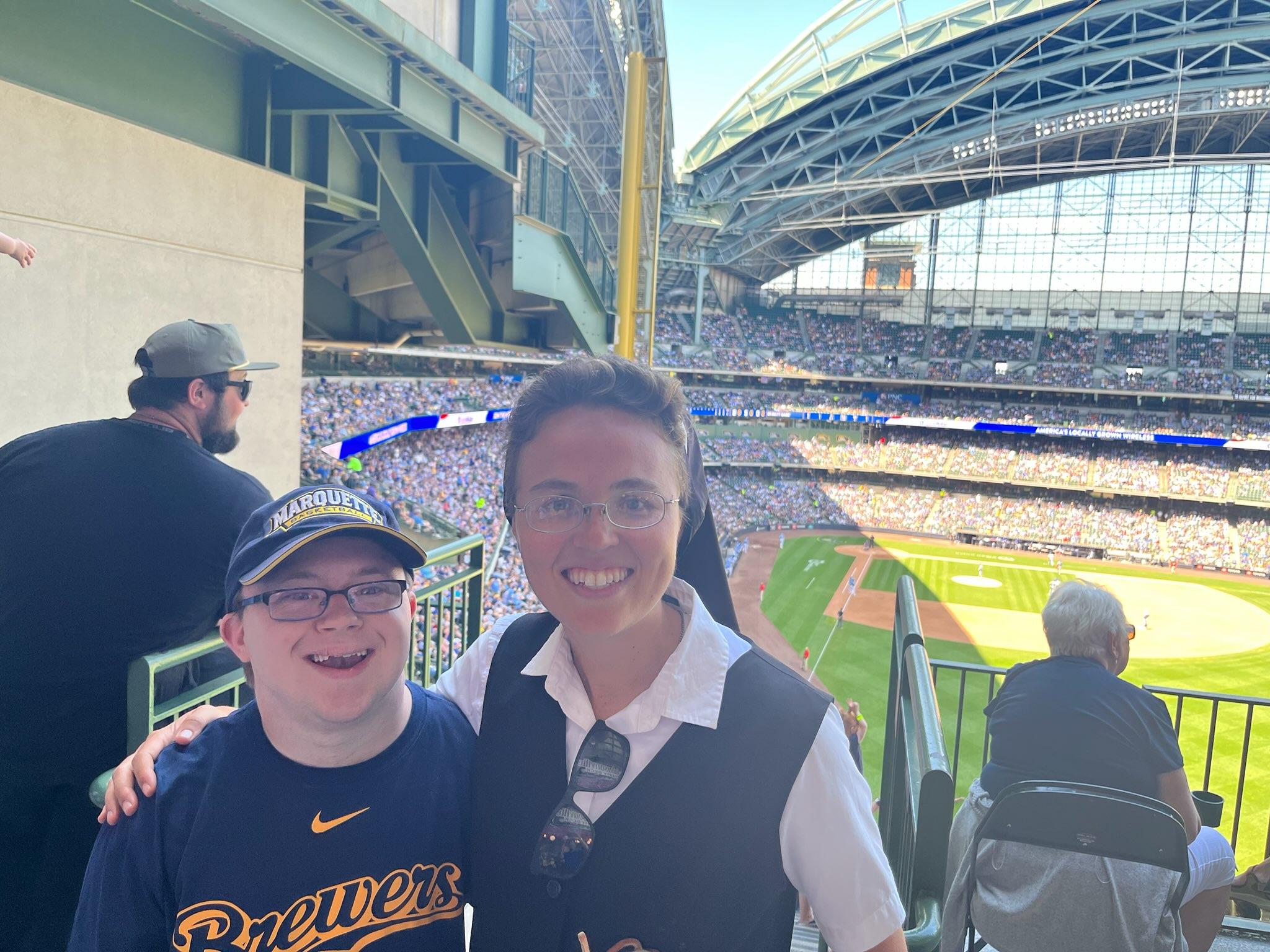 Racine mom, breast cancer survivor throws first pitch at Brewers